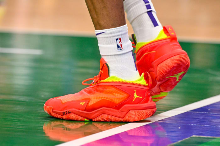 View of Russell Westbrook's red and yellow Jordan Brand shoes.
